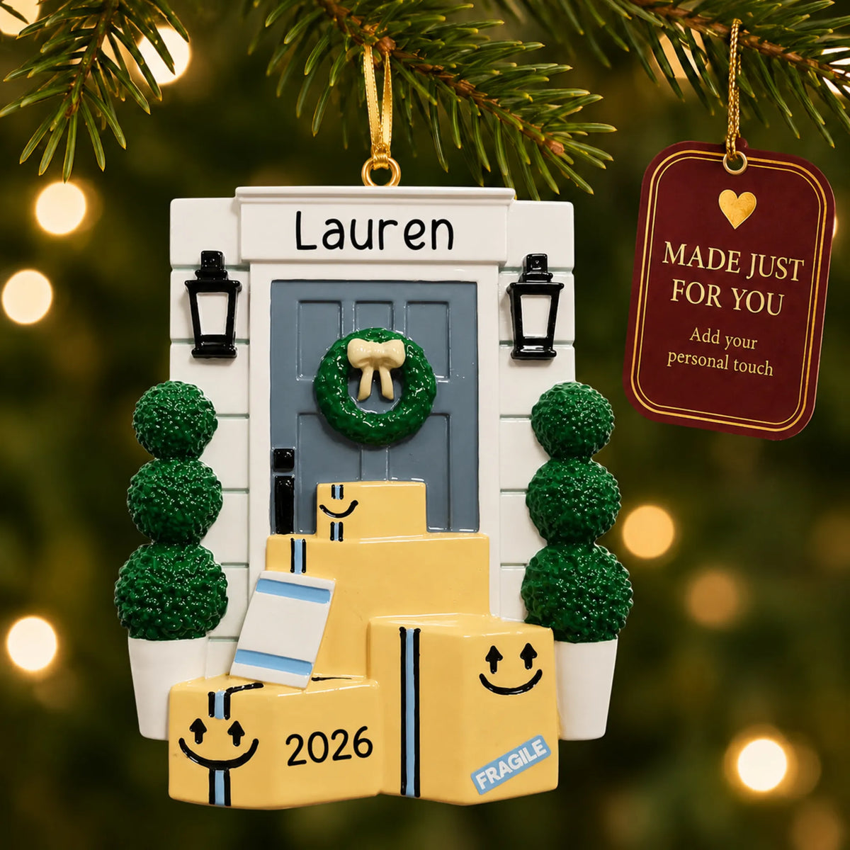 Online shopping delivery christmas ornament hanging on a lit Christmas tree with a Made Just For You gift tag