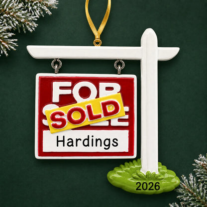 Personalized For Sale Sold New Home christmas ornament on a dark green pine background