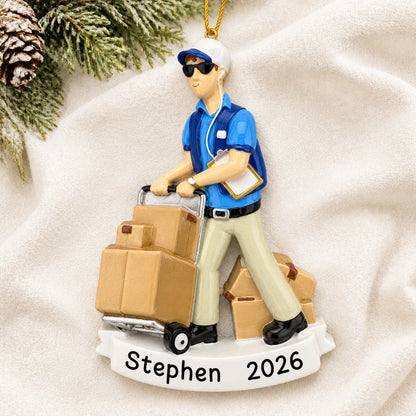 Personalized Amazon delivery guy christmas ornament laid on a soft white knit blanket
