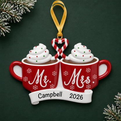 Personalized Mr & Mrs Hot Cocoa christmas ornament on a dark green pine background