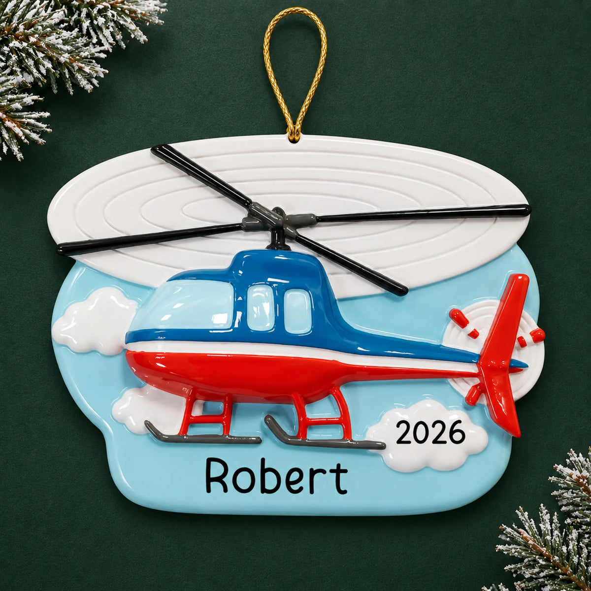 Personalized helicopter christmas ornament on a dark green pine background