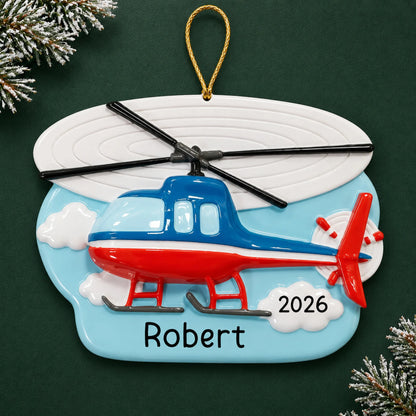 Personalized helicopter christmas ornament on a dark green pine background