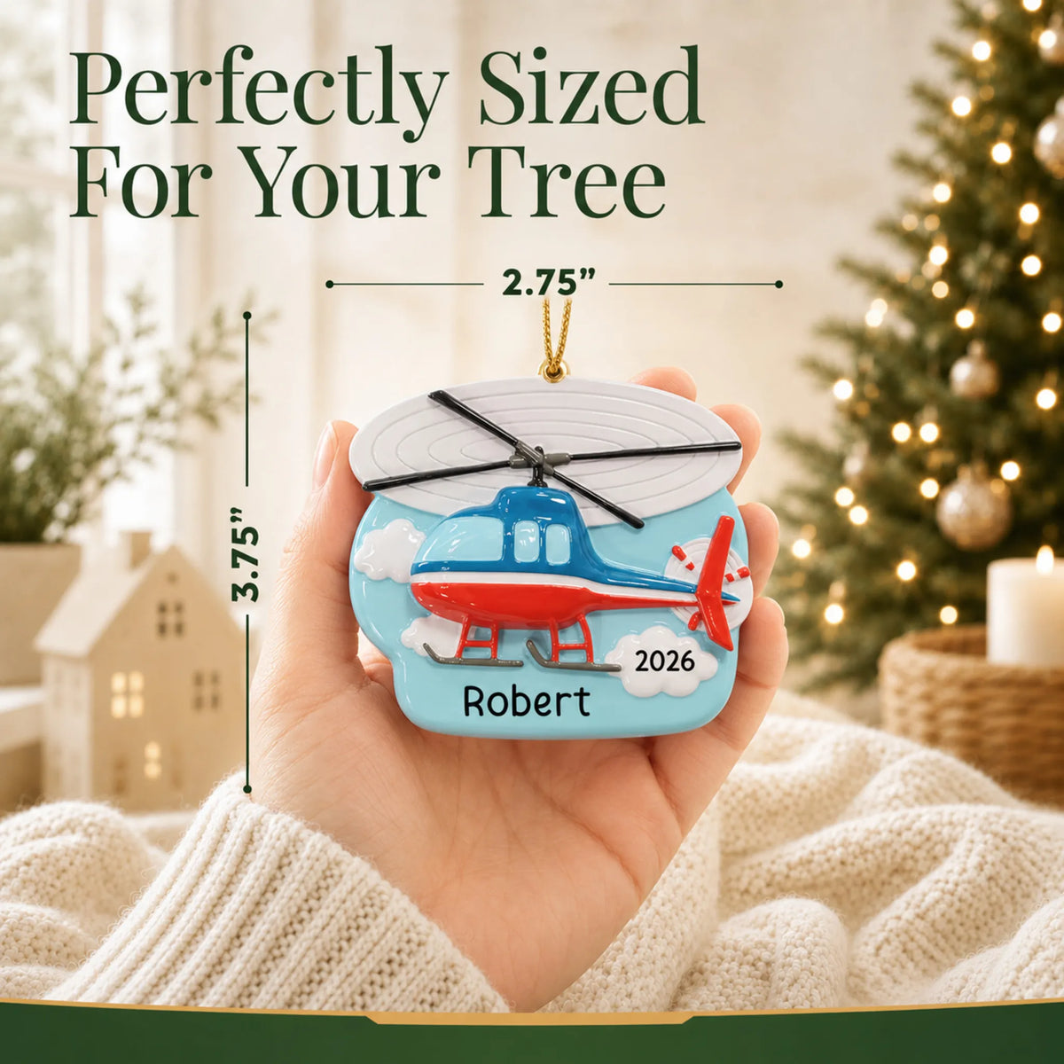 Size guide: the personalized helicopter christmas ornament is 2.75 in wide by 3.75 in tall, shown in hand