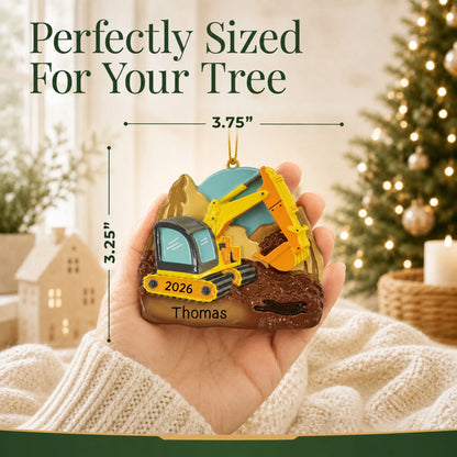 Size guide: the personalized digger christmas ornament is 3.75 in wide by 3.25 in tall, shown in hand