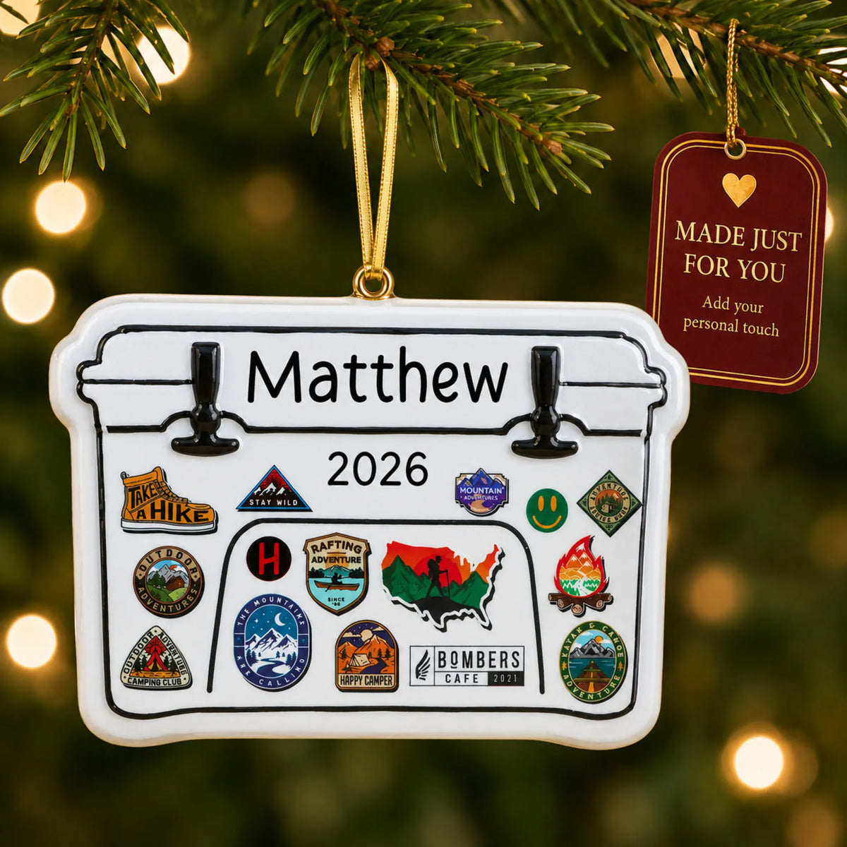 Yeti cooler christmas ornament hanging on a lit Christmas tree with a Made Just For You gift tag