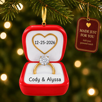 Engagement Ring christmas ornament hanging on a lit Christmas tree with a Made Just For You gift tag