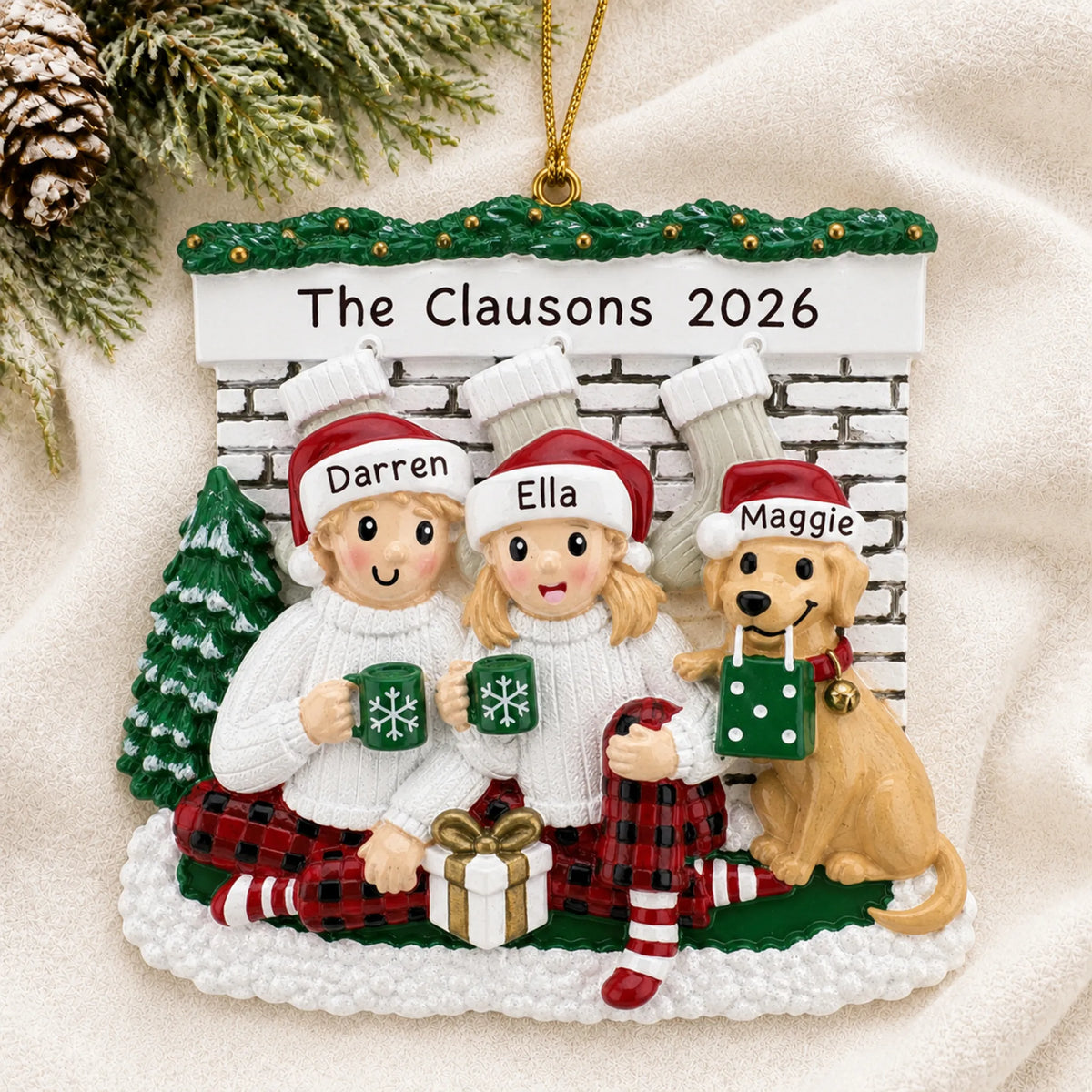 Personalized holiday couple with dog christmas ornament laid on a soft white knit blanket