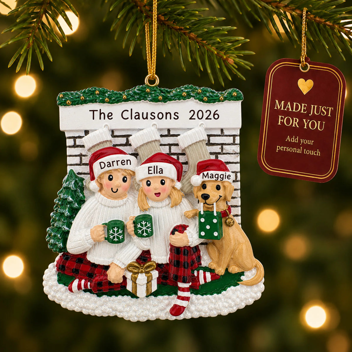 Holiday couple with dog christmas ornament hanging on a lit Christmas tree with a Made Just For You gift tag