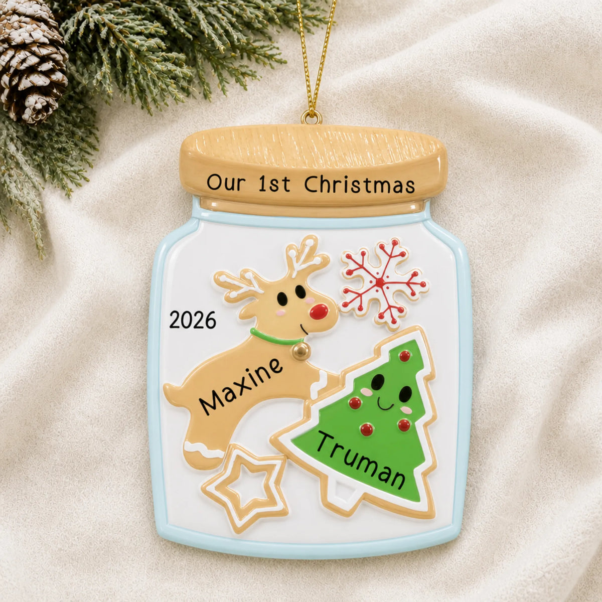 Personalized cookie jar couple christmas ornament laid on a soft white knit blanket