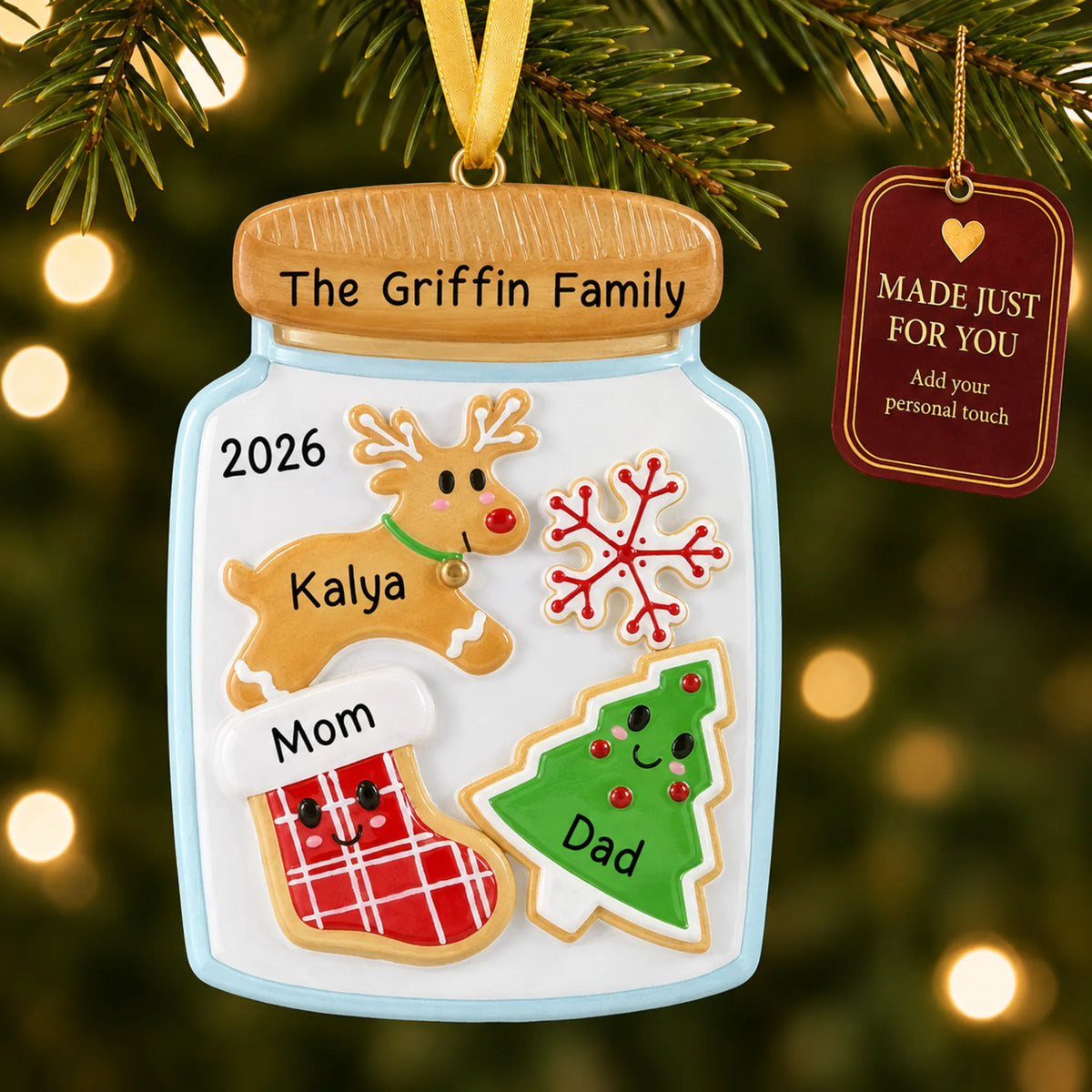 Cookie jar family of 3 christmas ornament hanging on a lit Christmas tree with a Made Just For You gift tag