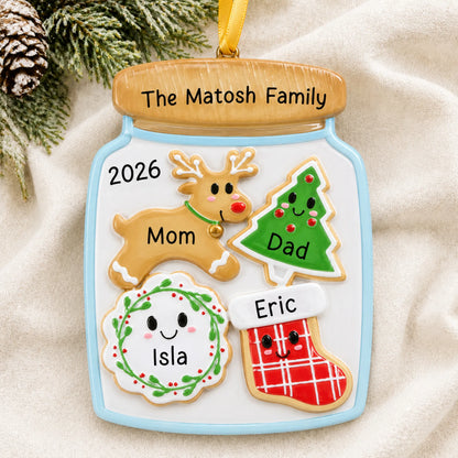 Personalized cookie jar family of 4 christmas ornament laid on a soft white knit blanket