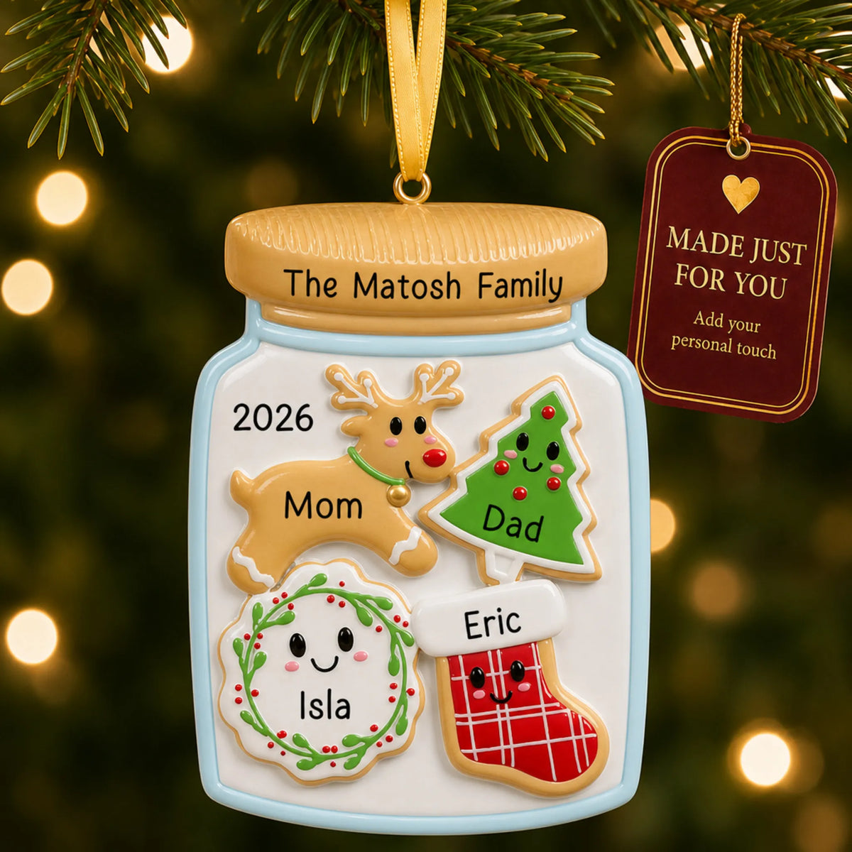 Cookie jar family of 4 christmas ornament hanging on a lit Christmas tree with a Made Just For You gift tag
