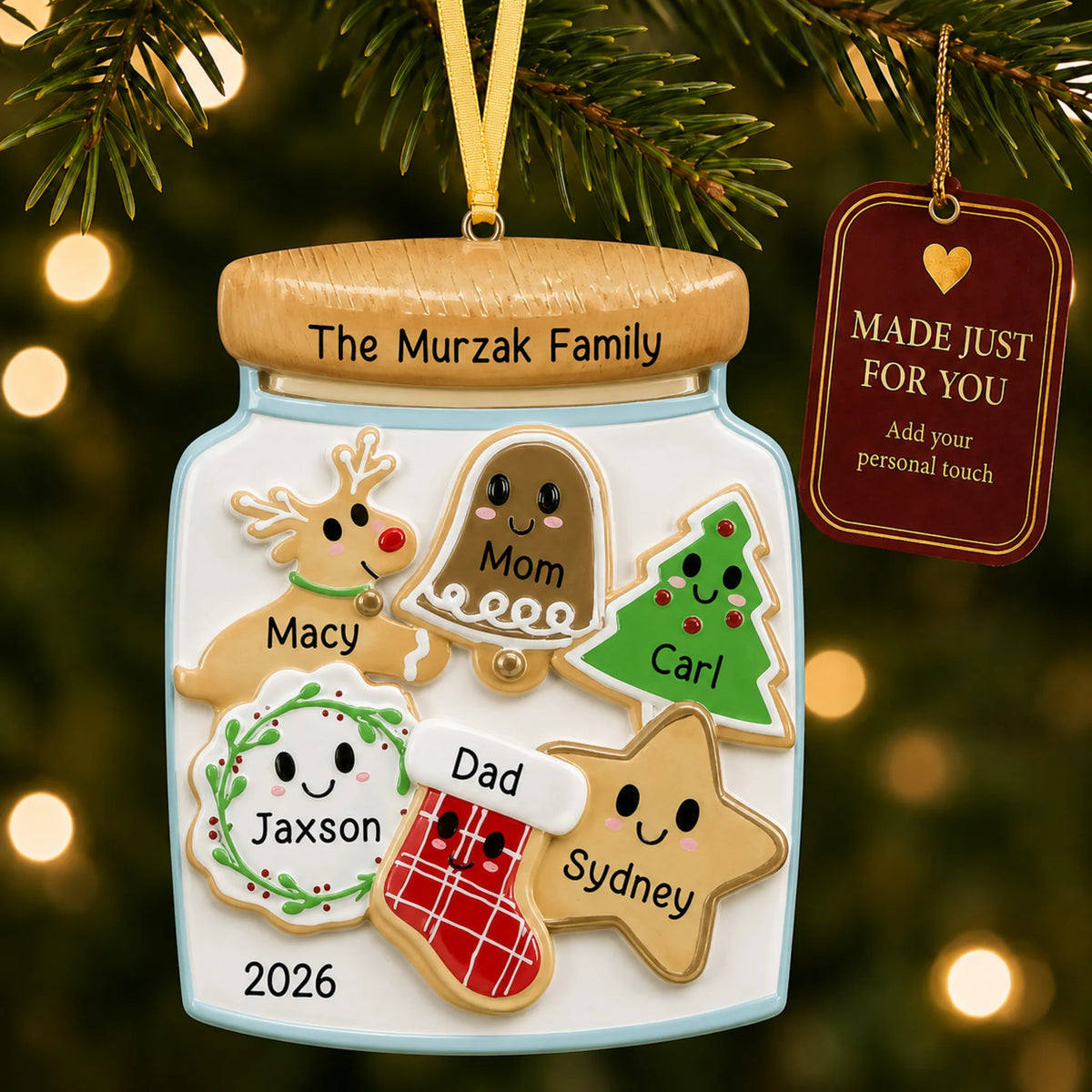 Cookie jar family of 6 christmas ornament hanging on a lit Christmas tree with a Made Just For You gift tag