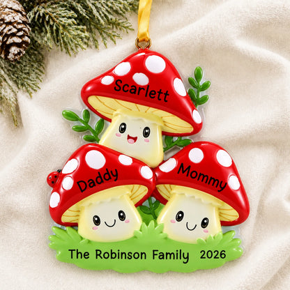 Personalized mushroom family of 3 christmas ornament laid on a soft white knit blanket