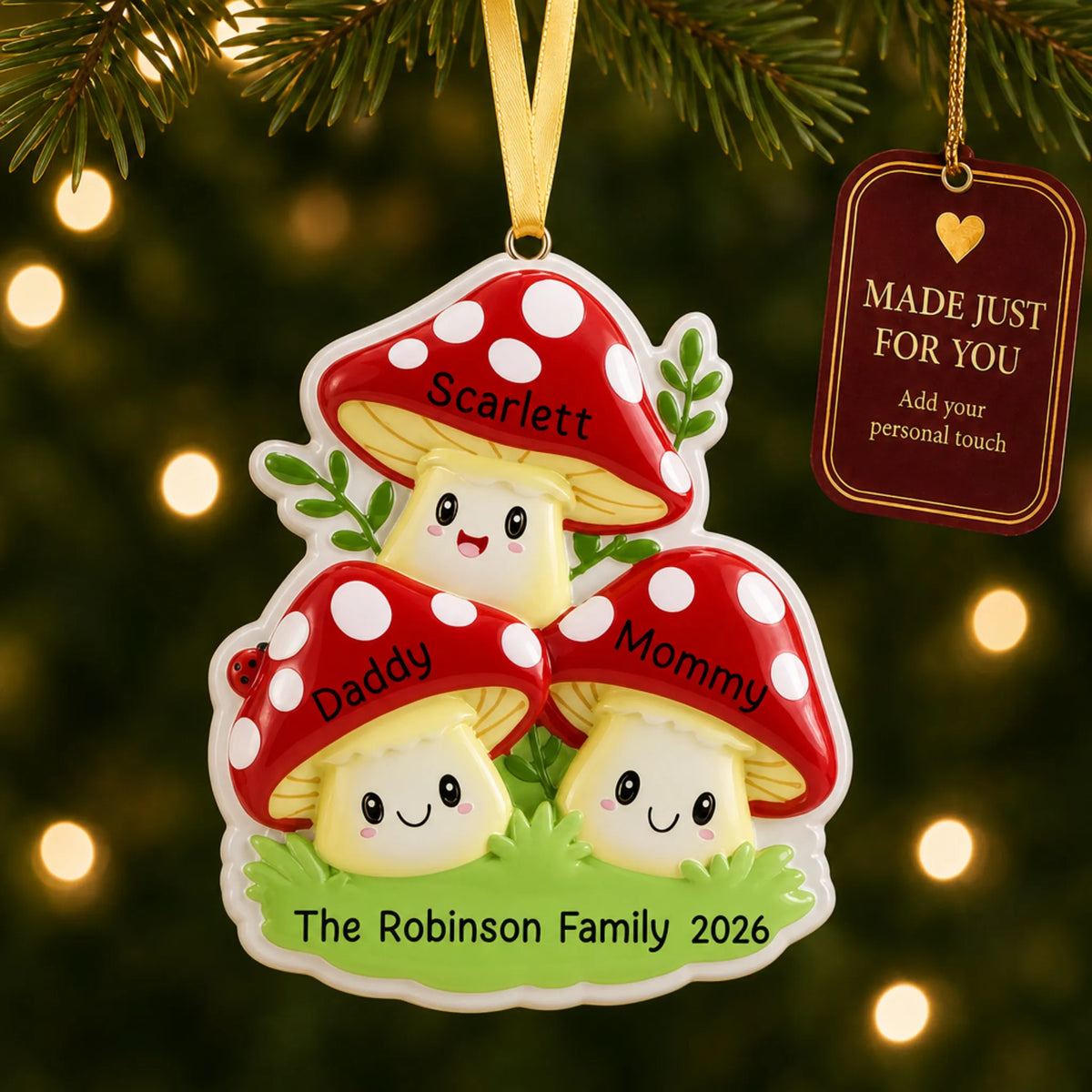 Mushroom family of 3 christmas ornament hanging on a lit Christmas tree with a Made Just For You gift tag