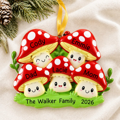 Personalized mushroom family of 5 christmas ornament laid on a soft white knit blanket