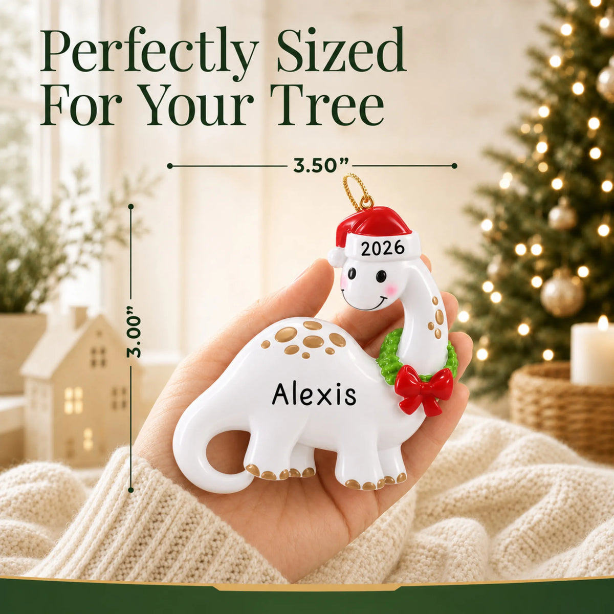 Size guide: the personalized white dinosaur christmas ornament is 3.50 in wide by 3.00 in tall, shown in hand
