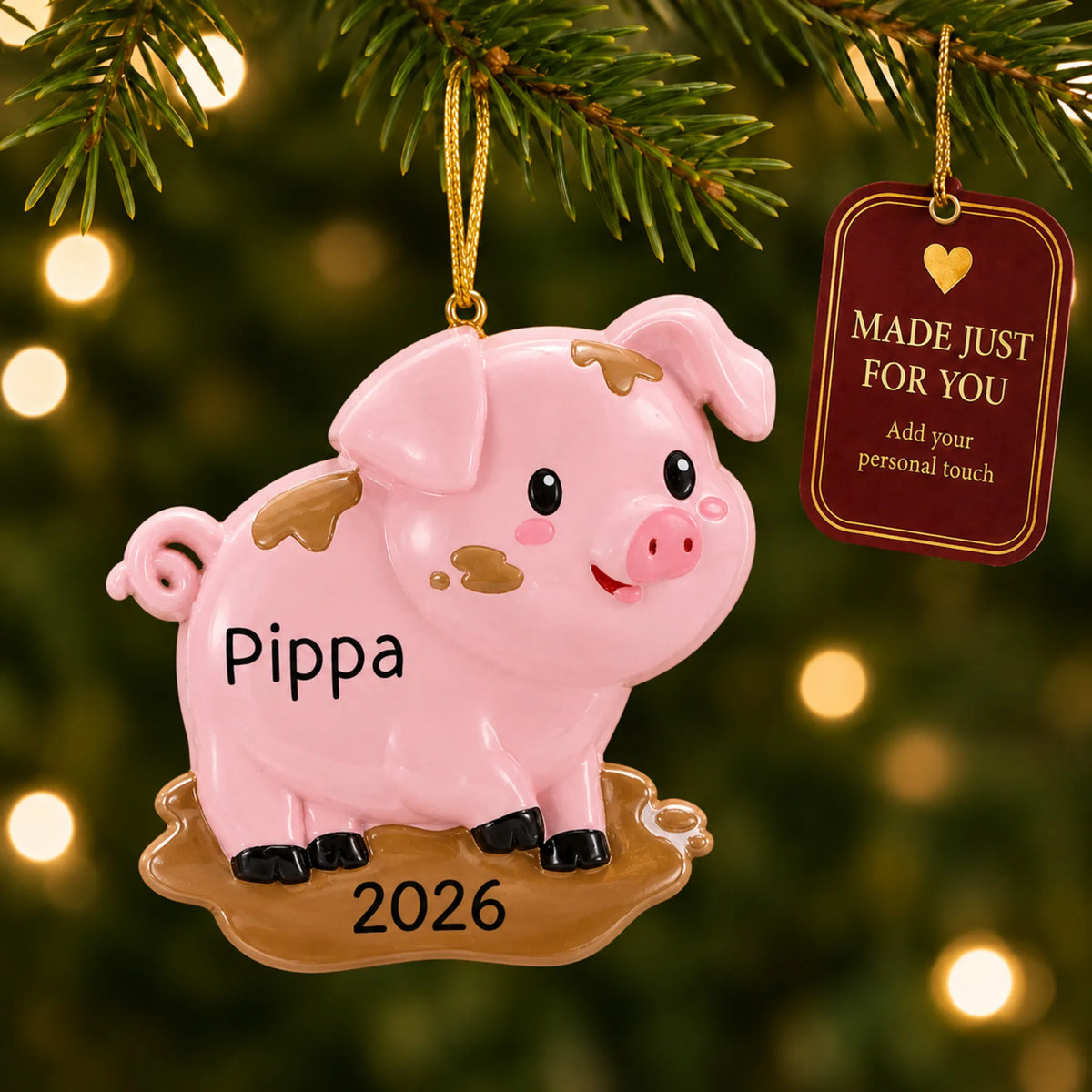Pig christmas ornament hanging on a lit Christmas tree with a Made Just For You gift tag