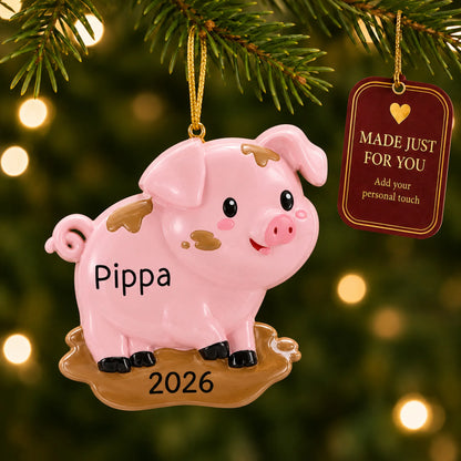 Pig christmas ornament hanging on a lit Christmas tree with a Made Just For You gift tag