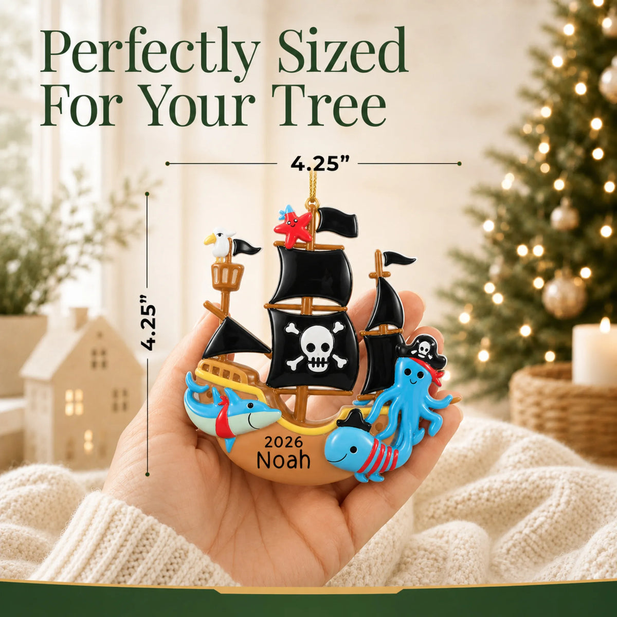 Size guide: the personalized pirate ship christmas ornament is 4.25 in wide by 4.25 in tall, shown in hand