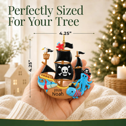 Size guide: the personalized pirate ship christmas ornament is 4.25 in wide by 4.25 in tall, shown in hand