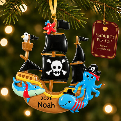 Pirate ship christmas ornament hanging on a lit Christmas tree with a Made Just For You gift tag