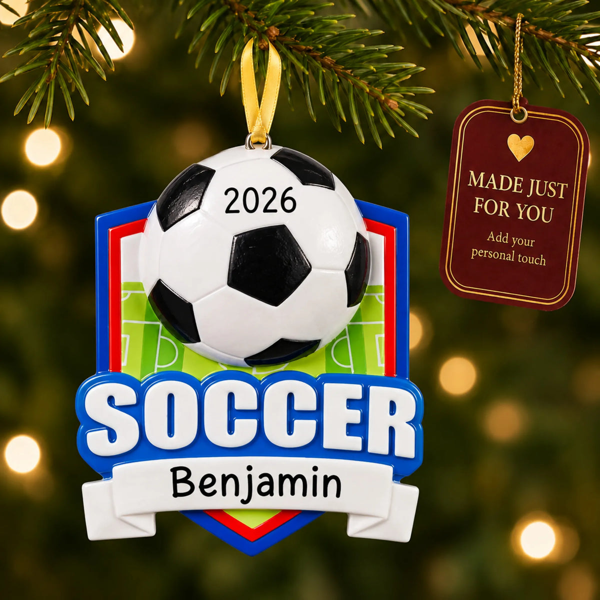 Soccer shield christmas ornament hanging on a lit Christmas tree with a Made Just For You gift tag
