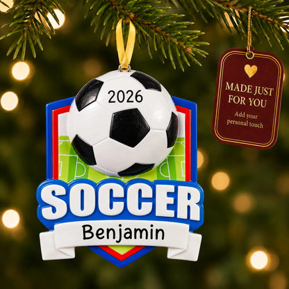 Soccer shield christmas ornament hanging on a lit Christmas tree with a Made Just For You gift tag