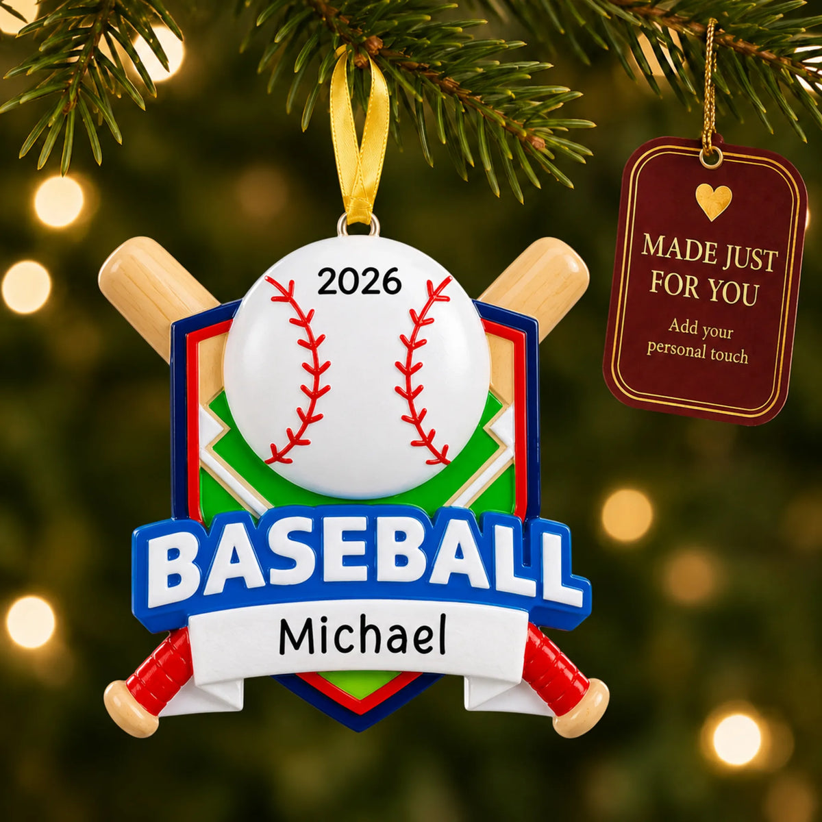 Baseball crossed bats christmas ornament hanging on a lit Christmas tree with a Made Just For You gift tag