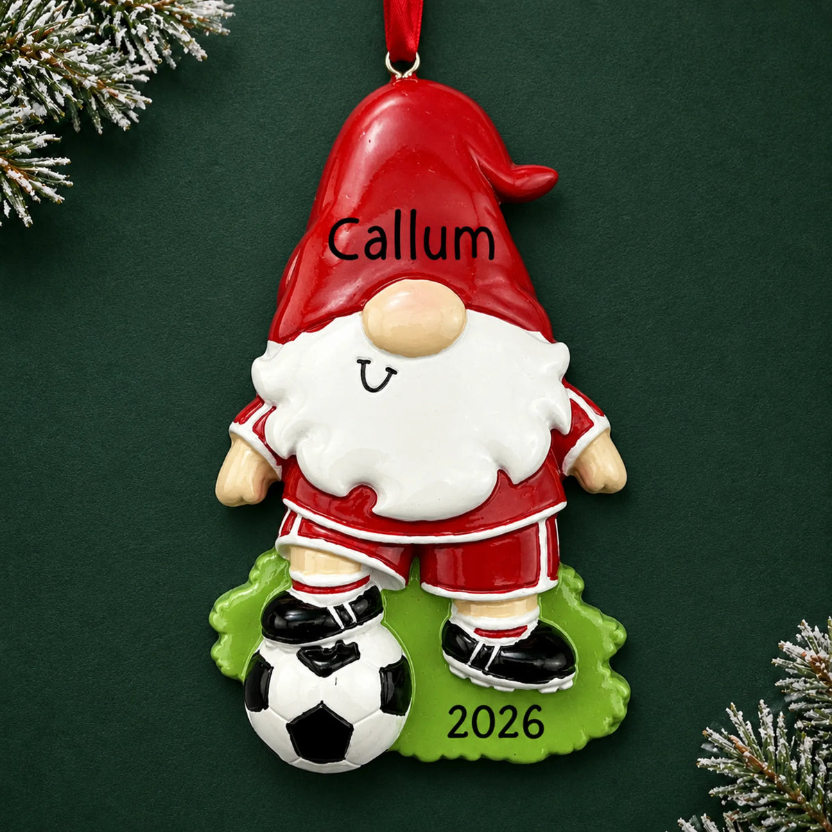 Personalized soccer gnome christmas ornament on a dark green pine background