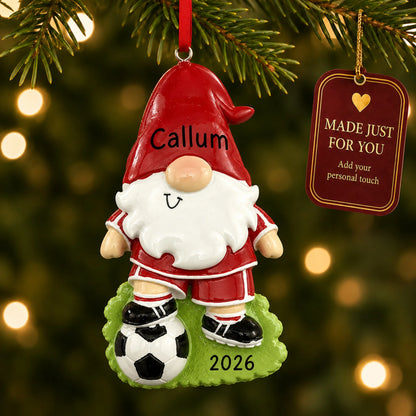 Soccer gnome christmas ornament hanging on a lit Christmas tree with a Made Just For You gift tag