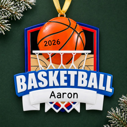 Personalized basketball shield christmas ornament on a dark green pine background