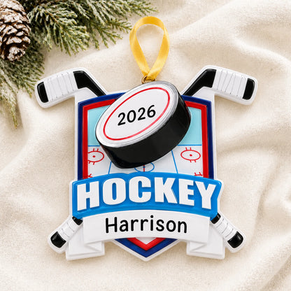 Personalized ice hockey collage christmas ornament laid on a soft white knit blanket