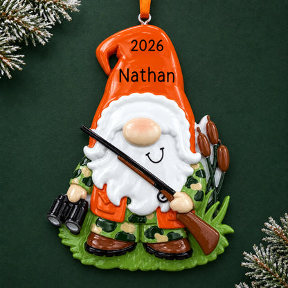 Personalized hunting gnome christmas ornament on a dark green pine background