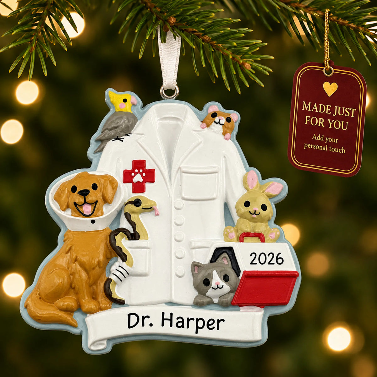 Veterinarian with animals christmas ornament hanging on a lit Christmas tree with a Made Just For You gift tag