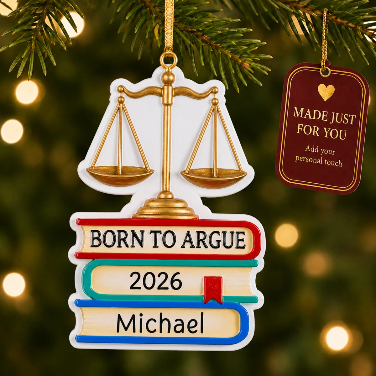 Born to Argue lawyer christmas ornament hanging on a lit Christmas tree with a Made Just For You gift tag