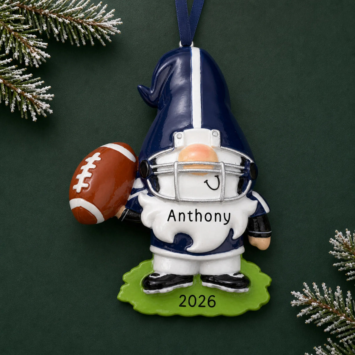 Personalized gnome football player christmas ornament on a dark green pine background