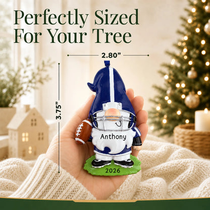 Size guide: the personalized gnome football player christmas ornament is 2.80 in wide by 3.75 in tall, shown in hand