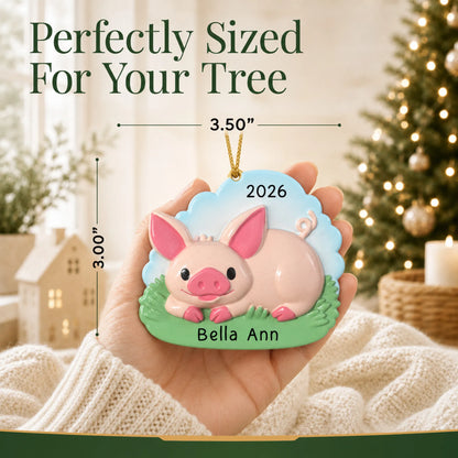 Size guide: the personalized cute pig christmas ornament is 3.50 in wide by 3.00 in tall, shown in hand