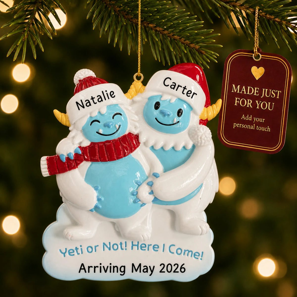 Expecting Yeti Couple christmas ornament hanging on a lit Christmas tree with a Made Just For You gift tag