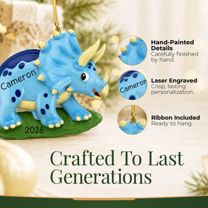 Hand-painted details and laser engraved personalization on the blue triceratops dinosaur christmas ornament, ribbon included