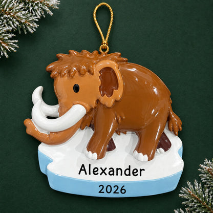 Personalized woolly mammoth christmas ornament on a dark green pine background