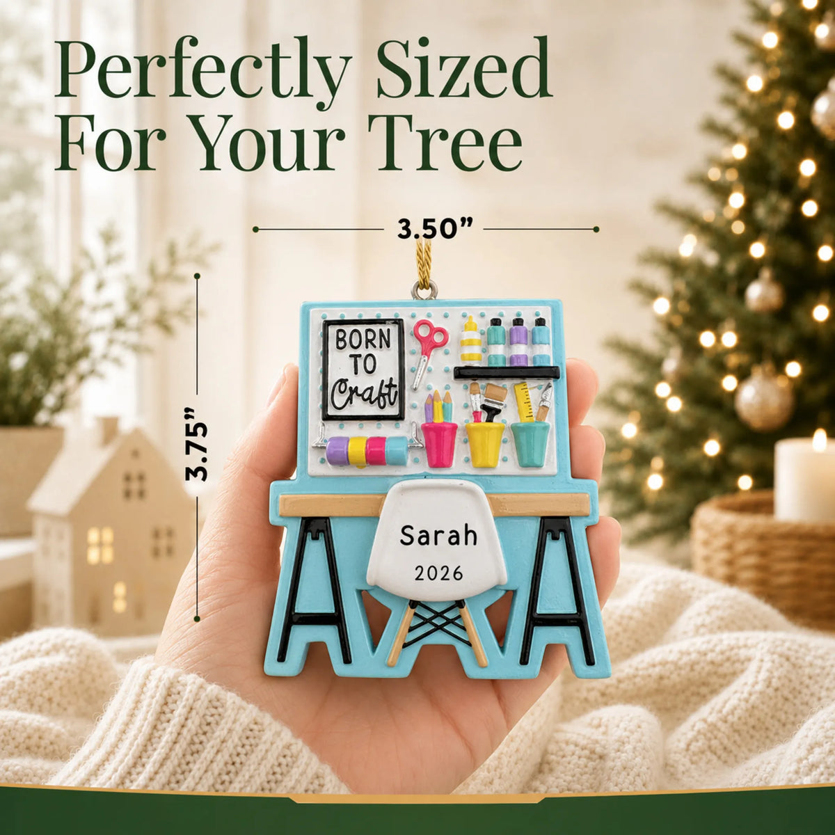 Size guide: the personalized arts and crafts table christmas ornament is 3.50 in wide by 3.75 in tall, shown in hand