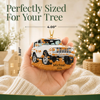 Size guide: the personalized Off-Road Truck christmas ornament is 4.00 in wide by 3.00 in tall, shown in hand