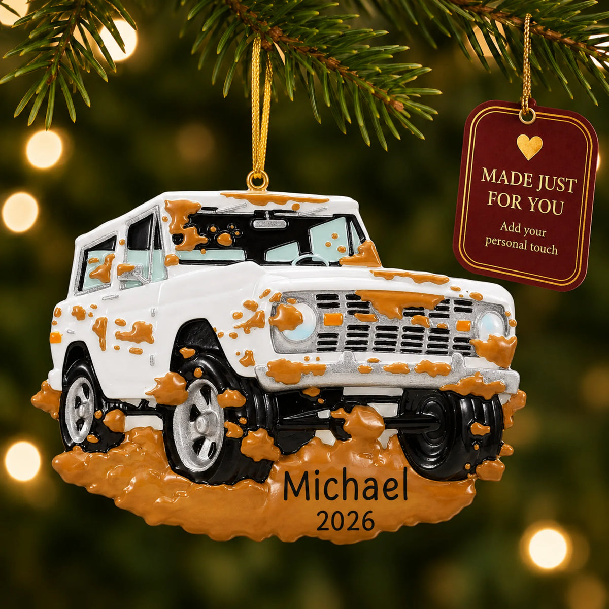 Off-Road Truck christmas ornament hanging on a lit Christmas tree with a Made Just For You gift tag