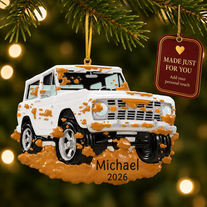 Off-Road Truck christmas ornament hanging on a lit Christmas tree with a Made Just For You gift tag