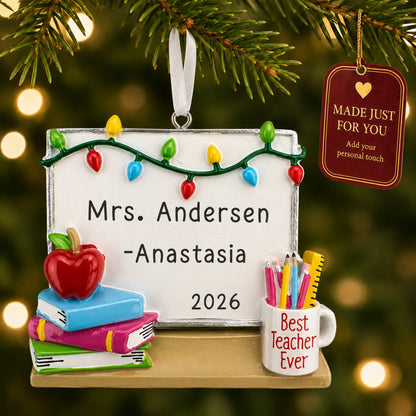 Personalized teacher whiteboard Christmas ornament hanging among tree lights with a Made Just For You tag