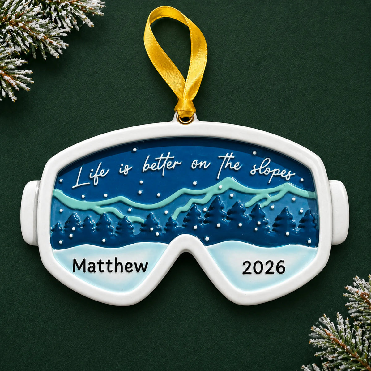 Personalized ski goggles christmas ornament on a dark green pine background
