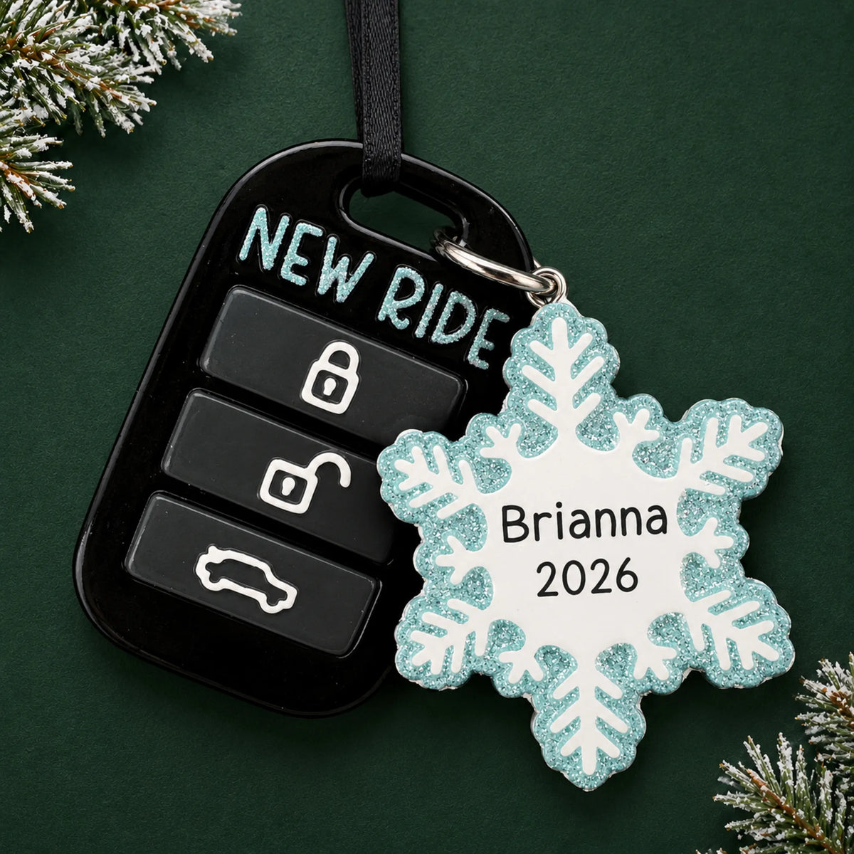 Personalized new car key fob christmas ornament on a dark green pine background