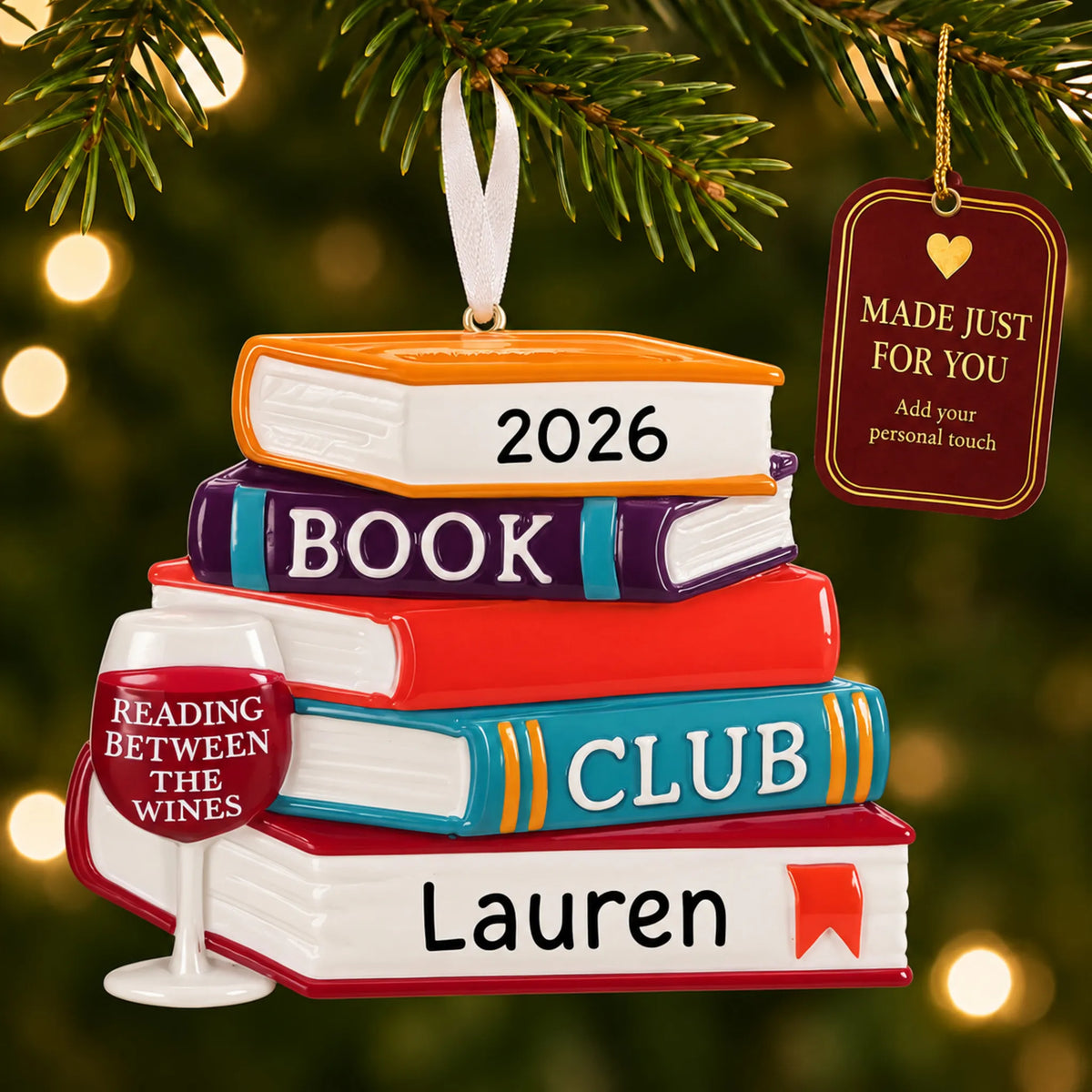 Book Club Wine Glass christmas ornament hanging on a lit Christmas tree with a Made Just For You gift tag